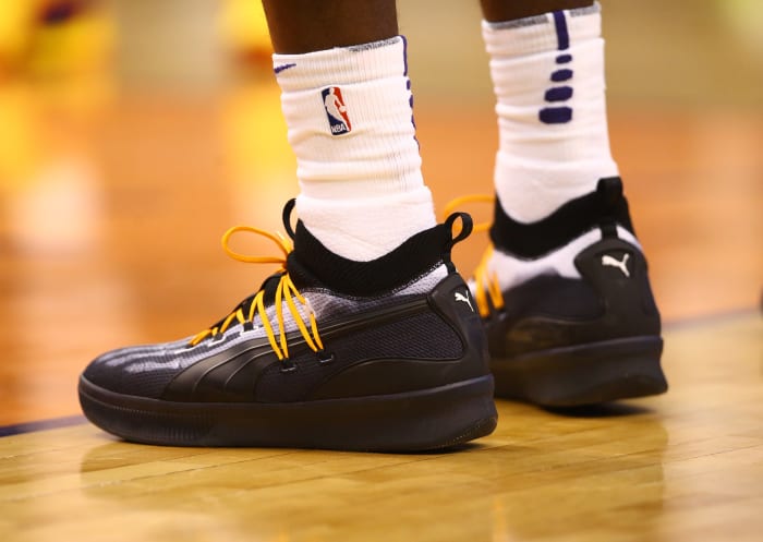 View of black and white Puma shoes.